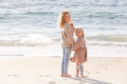 Sisters looking back on the beach